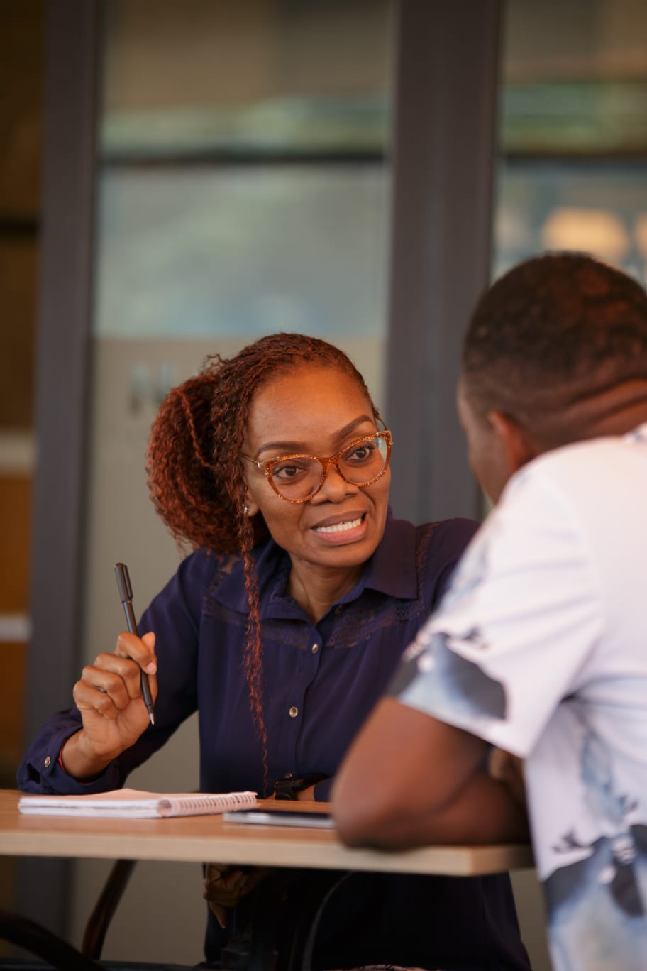 Miss Jackie listening during a one-to-one client conversation